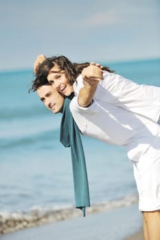 happy young couple in white clothing  have romantic recreation and   fun at beautiful beach on  vacations