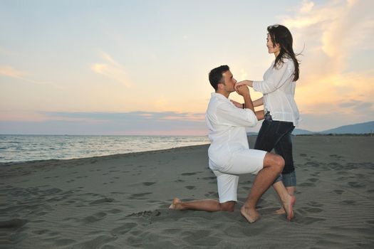 happy young couple have fun and romantic moments on beach at summer season and representing happynes and travel concept