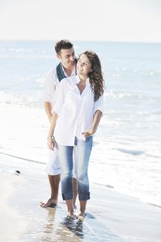 happy young couple in white clothing  have romantic recreation and   fun at beautiful beach on  vacations