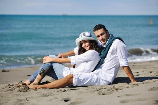 happy young couple in white clothing  have romantic recreation and   fun at beautiful beach on  vacations