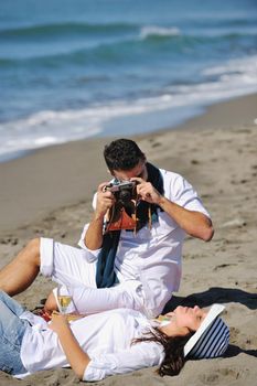 happy young couple relaxing in nature white making photos and taking images and posing for camera