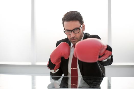 close up.a responsible businessman with Boxing gloves .the concept of protection