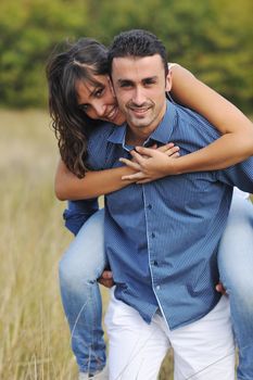 happy young couple have romantic time outdoor while smiling and hug