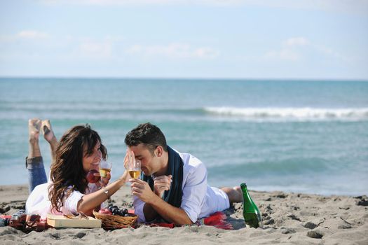 happy young family in white clothing have fun and play with beautiful dog at vacations on beautiful beach