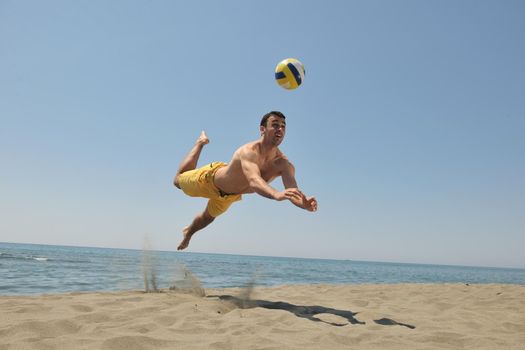 male beach volleyball game player jump on hot sand