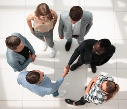 Handshake of business group leader, applause