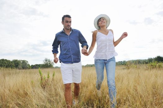 happy young couple have romantic time outdoor while smiling and hug