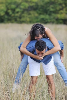 happy young couple have romantic time outdoor while smiling and hug