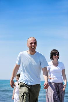 happy young couple have fun and romantic moments on beach at summer season and representing happynes and travel concept