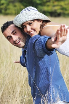 happy young couple have romantic time outdoor while smiling and hug