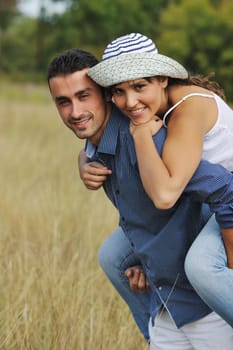 happy young couple have romantic time outdoor while smiling and hug