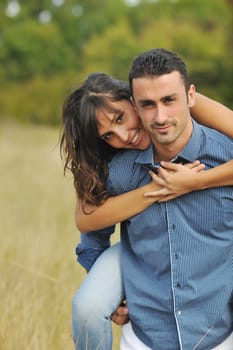 happy young couple have romantic time outdoor while smiling and hug