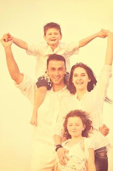 happy young family have fun and live healthy lifestyle on beach