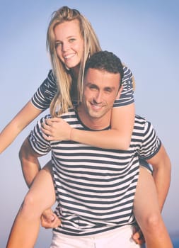 happy young couple have romantic time on beach at sunset