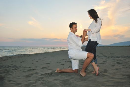 happy young couple have fun and romantic moments on beach at summer season and representing happynes and travel concept