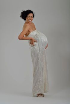 Portrait of a beautiful woman dressed as a bride isolated on white background in studio