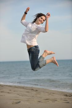 happy young couple have fun and romantic moments on beach at summer season and representing happynes and travel concept