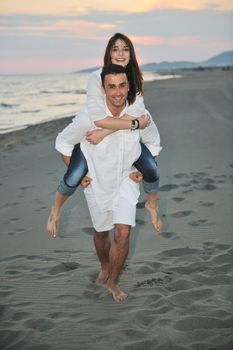 happy young couple have fun and romantic moments on beach at summer season and representing happynes and travel concept