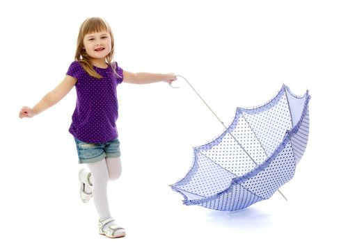 A beautiful little girl hid under an umbrella. The concept of summer vacation, style and fashion. Isolated on white background.