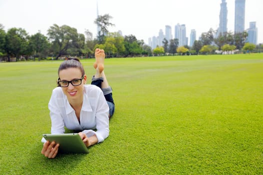 Beautiful young student  woman study with tablet in park