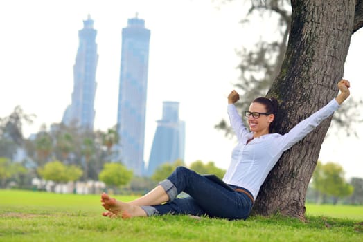 Beautiful young student  woman study with tablet in park