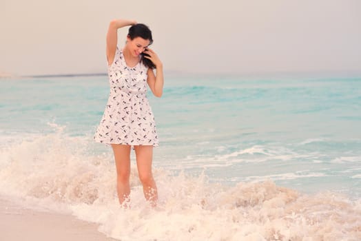 Happy Beautiful Woman Enjoying Summer Vacation on beach