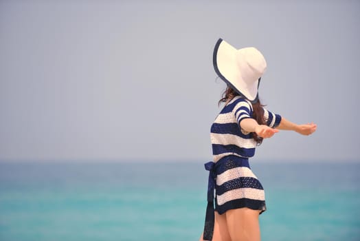 Happy Beautiful Woman Enjoying Summer Vacation on beach