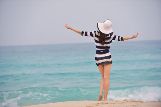 Happy Beautiful Woman Enjoying Summer Vacation on beach