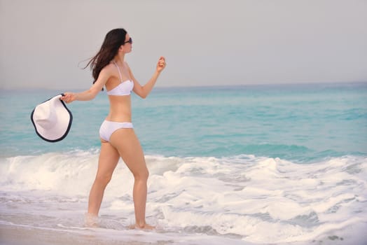 beautifel and happy woman girl on beach have fun and relax on summer vacation  over the beautiful tropical sea