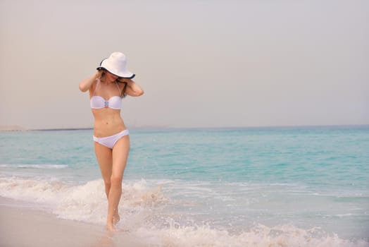 beautifel and happy woman girl on beach have fun and relax on summer vacation  over the beautiful tropical sea