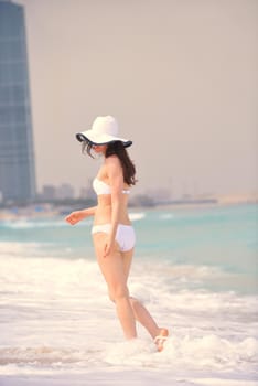 beautifel and happy woman girl on beach have fun and relax on summer vacation  over the beautiful tropical sea