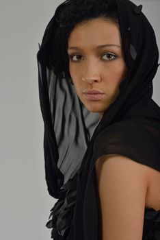 elegant woman in  fashionable  stylish dress posing in the studio