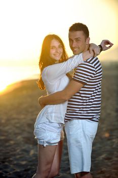 happy young couple have fun and romantic moments on beach at summer season and representing happynes and travel concept