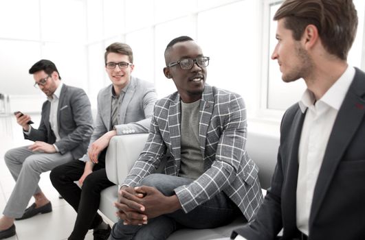 group of business people sitting in the office corridor.business concept