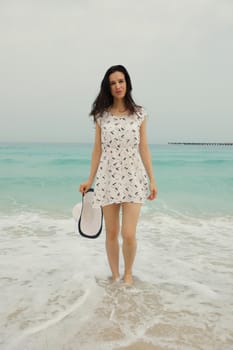 Happy Beautiful Woman Enjoying Summer Vacation on beach