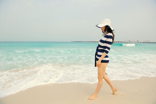 Happy Beautiful Woman Enjoying Summer Vacation on beach