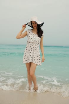 Happy Beautiful Woman Enjoying Summer Vacation on beach