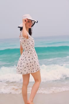 Happy Beautiful Woman Enjoying Summer Vacation on beach