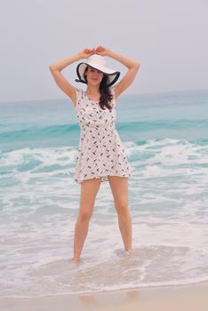 Happy Beautiful Woman Enjoying Summer Vacation on beach