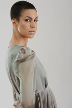 elegant woman in  fashionable  stylish dress posing in the studio