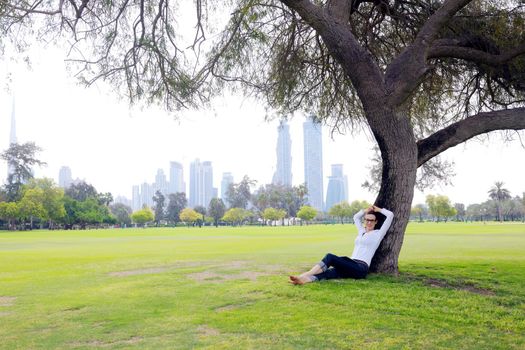 Beautiful young student  woman study with tablet in park