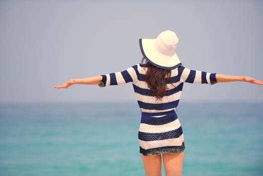 Happy Beautiful Woman Enjoying Summer Vacation on beach