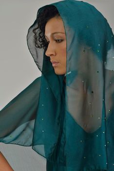 elegant woman in  fashionable  stylish dress posing in the studio