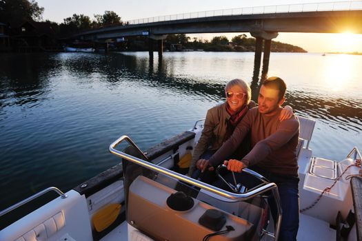 happy young couple in love  have romantic time at summer sunset   at ship boat while  representing urban and countryside fashin lifestyle