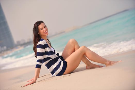 portrait of happy young woman on beach at summer vacation