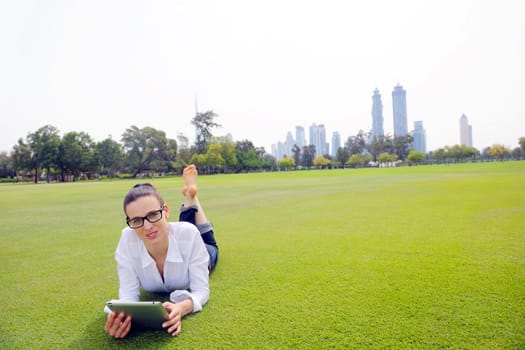 Beautiful young student  woman study with tablet in park