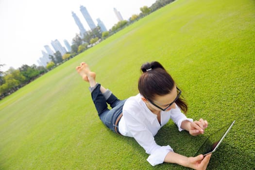 Beautiful young student  woman study with tablet in park