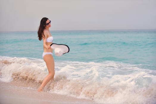 beautifel and happy woman girl on beach have fun and relax on summer vacation  over the beautiful tropical sea