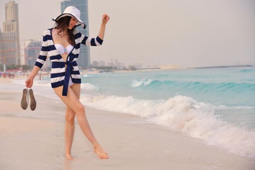 Happy Beautiful Woman Enjoying Summer Vacation on beach