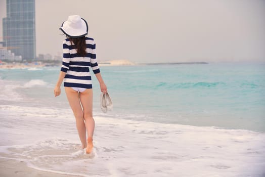 Happy Beautiful Woman Enjoying Summer Vacation on beach